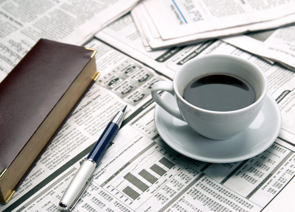 cup of coffee on the newspaper 2021 08 26 22 32 46 utc 2